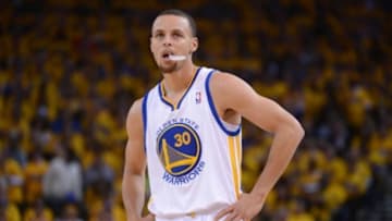 Apr 27, 2014; Oakland, CA, USA; Golden State Warriors guard Stephen Curry (30) looks on during the first quarter in game four of the first round of the 2014 NBA Playoffs against the Los Angeles Clippers at Oracle Arena. The Warriors defeated the Clippers 118-97. Mandatory Credit: Kyle Terada-USA TODAY Sports