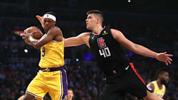 LOS ANGELES, CALIFORNIA - MARCH 04: Rajon Rondo #9 of the Los Angeles Lakers rebounds past Ivica Zubac #40 of the Los Angeles Clippers during the first half of a game at Staples Center on March 04, 2019 in Los Angeles, California. (Photo by Sean M. Haffey/Getty Images)