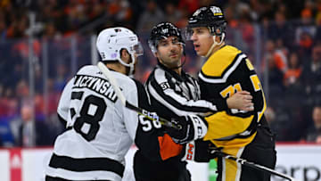 Nov 25, 2022; Philadelphia, Pennsylvania, USA; A referee separates Philadelphia Flyers center Tanner Laczynski (58) and Pittsburgh Penguins center Evgeni Malkin (71) in the second period at Wells Fargo Center. Mandatory Credit: Kyle Ross-USA TODAY Sports