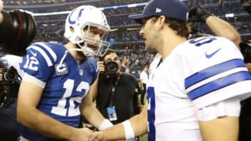 Dec 21, 2014; Arlington, TX, USA; Indianapolis Colts quarterback Andrew Luck (12) talks with Dallas Cowboys quarterback Tony Romo (9) after the game at AT&T Stadium. The Cowboys beat the Colts 42-7. Mandatory Credit: Matthew Emmons-USA TODAY Sports