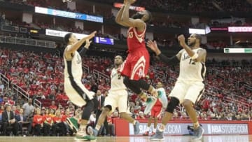 Dec 25, 2015; Houston, TX, USA; Houston Rockets guard James Harden (13) drives against the San Antonio Spurs in the second half of a NBA basketball game on Christmas at Toyota Center. Rockets won 88 to 84. Mandatory Credit: Thomas B. Shea-USA TODAY Sports