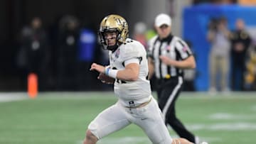 ATLANTA, GA - JANUARY 1: McKenzie Milton #10 of the Central Florida Knights scrambles against the Auburn Tigers during the Chick-fil-A Peach Bowl on January 1, 2018 in Atlanta, Georgia. (Photo by Scott Cunningham/Getty Images)