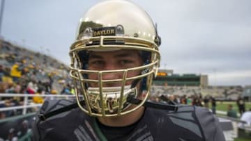 Oct 5, 2013; Waco, TX, USA; Baylor Bears long snapper Jimmy Landes (50) shows off the new chrome helmets of the Bears before the game against the West Virginia Mountaineers at Floyd Casey Stadium. Mandatory Credit: Jerome Miron-USA TODAY Sports
