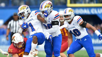 LAWRENCE, KS - NOVERMBER 3: Pooka Williams Jr. #1 of the Kansas Jayhawks is tackled by linebacker Jake Hummel #35 of the Iowa State Cyclones in the first quarter at Memorial Stadium on November 3, 2018 in Lawrence, Kansas. (Photo by Ed Zurga/Getty Images)