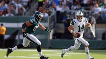 Sep 27, 2015; East Rutherford, NJ, USA; New York Jets quarterback Ryan Fitzpatrick (14) scrambles away from Philadelphia Eagles defensive end Brandon Bair (93) during the third quarter at MetLife Stadium. Mandatory Credit: Brad Penner-USA TODAY Sports