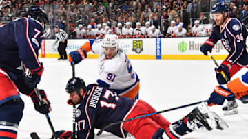 COLUMBUS, OH - FEBRUARY 25: Brandon Dubinsky #17 of the Columbus Blue Jackets and John Tavares #91 of the New York Islanders battle for the puck following a face-off during the second period of a game on February 25, 2017 at Nationwide Arena in Columbus, Ohio. (Photo by Jamie Sabau/NHLI via Getty Images)