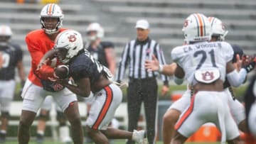 Auburn football quarterback T.J. Finley (1) hands the ball off to Auburn Tigers running back Damari Alston (22) during the A-Day spring football game at Jordan-Hare Stadium in Auburn, Ala., on Saturday, April 8, 2023.