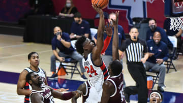 Jan 23, 2021; Oxford, Mississippi, USA; Mississippi Rebels guard Jarkel Joiner (24) lays the ball up against Texas A&M Aggies guard Hassan Diarra (11) during the second half at The Pavilion at Ole Miss. Mandatory Credit: Justin Ford-USA TODAY Sports