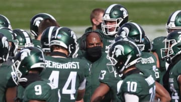 Michigan State coach Mel Tucker talks with his team on the sidelines during MSU's 38-27 loss on Saturday, Oct. 24, 2020, at Spartan Stadium.Msu