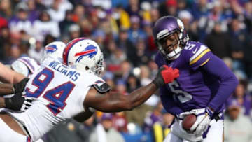 Oct 19, 2014; Orchard Park, NY, USA; Buffalo Bills defensive end Mario Williams (94) sacks Minnesota Vikings quarterback Teddy Bridgewater (5) during the first half at Ralph Wilson Stadium. Mandatory Credit: Timothy T. Ludwig-USA TODAY Sports