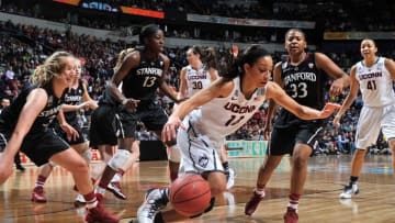 NASHVILLE, TN - APRIL 06: Bria Hartley #14 of the Connecticut Huskies plays against Mikaela Ruef #3, Chiney Ogqumike #13 and Amber Orrange #33 of the Stanford Cardinal at Bridgestone Arena on April 6, 2014 in Nashville, Tennessee. (Photo by Frederick Breedon/Getty Images)