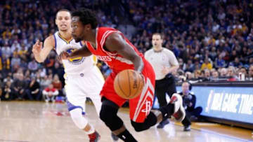 Jan 21, 2015; Oakland, CA, USA; Houston Rockets guard Patrick Beverley (2) drives in against Golden State Warriors guard Stephen Curry (30) during the first quarter at Oracle Arena. Mandatory Credit: Kelley L Cox-USA TODAY Sports