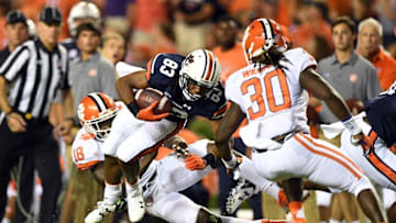 Sep 3, 2016; Auburn, AL, USA; Auburn Tigers wide receiver Ryan Davis (83) tries to shake off Clemson Tigers linebacker Ben Boulware (10) during the third quarter at Jordan Hare Stadium. Mandatory Credit: John David Mercer-USA TODAY Sports