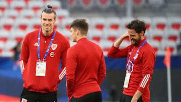 Wales' midfielder Gareth Bale (L) jokes with teammates as they inspect the pitch before the friendly football match between France and Wales at the Allianz Riviera Stadium in Nice, southern France on June 2, 2021 as part of the team's preparation for the upcoming 2020-2021 Euro football tournament. (Photo by FRANCK FIFE / AFP) (Photo by FRANCK FIFE/AFP via Getty Images)