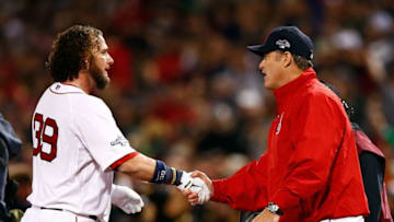 BOSTON, MA - OCTOBER 13: Manager John Farrell #53 shakes hands with Jarrod Saltalamacchia #39 of the Boston Red Sox after defeating the Detroit Tigers in Game Two of the American League Championship Series at Fenway Park on October 13, 2013 in Boston, Massachusetts. (Photo by Jared Wickerham/Getty Images)