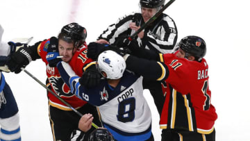 Winnipeg Jets and Calgary Flames (Photo by Jeff Vinnick/Getty Images)