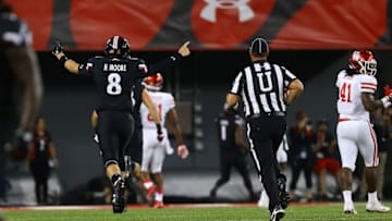 Sep 15, 2016; Cincinnati, OH, USA; Cincinnati Bearcats quarterback Hayden Moore (8) reacts after throwing a touchdown pass to wide receiver Devin Gray (not pictured) against the Houston Cougars in the first half at Nippert Stadium. Mandatory Credit: Aaron Doster-USA TODAY Sports
