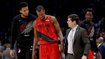 DENVER, COLORADO - MAY 12: Rodney Hood #5 of the Portland Trail Blazers is helped off the floor after being injured against the Denver Nuggets in the third quarter during Game Seven of the Western Conference Semi-Finals of the 2019 NBA Playoffs at the Pepsi Center on May 12, 2019 in Denver, Colorado. NOTE TO USER: User expressly acknowledges and agrees that, by downloading and or using this photograph, User is consenting to the terms and conditions of the Getty Images License Agreement. (Photo by Matthew Stockman/Getty Images)