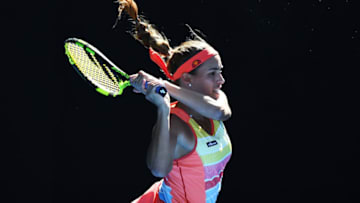 MELBOURNE, AUSTRALIA - JANUARY 15: Monica Puig of Puerto Rico plays a backhand in her first round match against Samantha Stosur of Australia on day one of the 2018 Australian Open at Melbourne Park on January 15, 2018 in Melbourne, Australia. (Photo by Quinn Rooney/Getty Images)