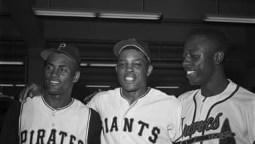 National League stars Roberto Clemente, Willie Mays, and Hank Aaron stand together for a victory portrait after the All-Star Game of 1961 in San Francisco.