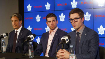 TORONTO, ON - JULY 1: Kyle Dubas, General Manager of the Toronto Maple Leafs speaks at a press conference about signing free agent, John Tavares #91 of the Toronto Maple Leafs, as Brendan Shanahan, President of the Toronto Maple Leafs, looks on, at the Scotiabank Arena on July 1, 2018 in Toronto, Ontario, Canada. (Photo by Mark Blinch/NHLI via Getty Images)