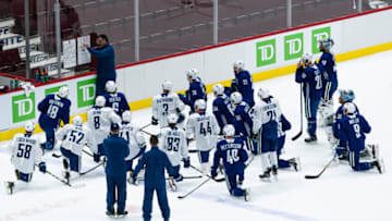 VANCOUVER, BC - JANUARY 4: Head coach Travis Green of the Vancouver Canucks draws up a drill on the whiteboard on the first day of the Vancouver Canucks NHL Training Camp at Rogers Arena on January 4, 2021 in Vancouver, British Columbia, Canada. (Photo by Rich Lam/Getty Images)