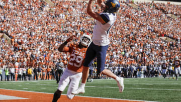 AUSTIN, TX - NOVEMBER 03: David Sills V #13 of the West Virginia Mountaineers catches a pass for a touchdown defended by Josh Thompson #29 of the Texas Longhorns in the second quarter at Darrell K Royal-Texas Memorial Stadium on November 3, 2018 in Austin, Texas. (Photo by Tim Warner/Getty Images)