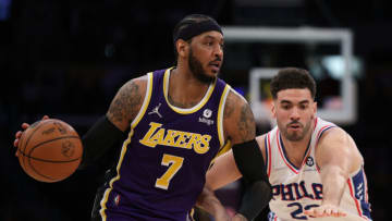 LOS ANGELES, CALIFORNIA - MARCH 23: Carmelo Anthony #7 of the Los Angeles Lakers keeps his dribble as he is defended by Georges Niang #20 of the Philadelphia 76ers during a 126-121 76ers win at Crypto.com Arena on March 23, 2022 in Los Angeles, California. (Photo by Harry How/Getty Images) NOTE TO USER: User expressly acknowledges and agrees that, by downloading and/or using this Photograph, user is consenting to the terms and conditions of the Getty Images License Agreement. Mandatory Copyright Notice: Copyright 2022 NBAE