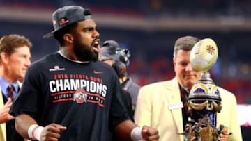 Jan 1, 2016; Glendale, AZ, USA; Ohio State Buckeyes running back Ezekiel Elliott celebrates with the trophy following the game against the Notre Dame Fighting Irish during the 2016 Fiesta Bowl at University of Phoenix Stadium. The Buckeyes defeated the Fighting Irish 44-28. Mandatory Credit: Mark J. Rebilas-USA TODAY Sports