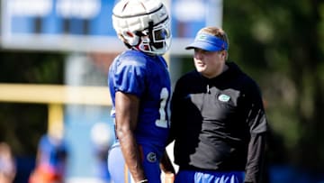 Florida Gators safety Miguel Mitchell (10) talks with Florida Gators defensive coordinator Austin Armstrong during spring football practice at Sanders Outdoor Practice Fields in Gainesville, FL on Thursday, March 23, 2023. [Matt Pendleton/Gainesville Sun]Ncaa Football Florida Gators Spring Football Practice
