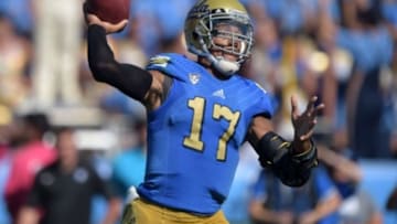Oct 11, 2014; Pasadena, CA, USA; UCLA Bruins quarterback Brett Hundley (17) throws a pass against the Oregon Ducks at Rose Bowl. Mandatory Credit: Kirby Lee-USA TODAY Sports
