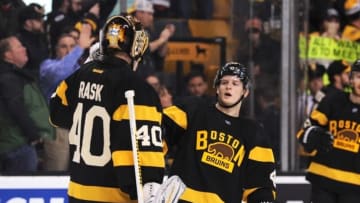 Mar 3, 2016; Boston, MA, USA; Boston Bruins defenseman Torey Krug (47) congratulates goalie Tuukka Rask (40) after defeating the Chicago Blackhawks at TD Garden. Mandatory Credit: Bob DeChiara-USA TODAY Sports