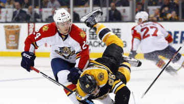 Mar 24, 2016; Boston, MA, USA; Boston Bruins defenseman Kevan Miller (86) is spilled by Florida Panthers left wing Jiri Hudler (24) during the second period at TD Garden. Mandatory Credit: Winslow Townson-USA TODAY Sports