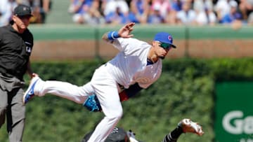 CHICAGO, ILLINOIS - AUGUST 23: Victor Robles #16 of the Washington Nationals steals second base in front of Javier Baez #9 of the Chicago Cubs during the third inning of a game at Wrigley Field on August 23, 2019 in Chicago, Illinois. (Photo by Nuccio DiNuzzo/Getty Images)