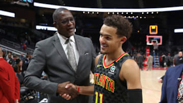 Mar 9, 2020; Atlanta, Georgia, USA; NBA Hall of Fame player Dominique Wilkins, left, congratulates Atlanta Hawks guard Trae Young (11) after their double overtime win against the Charlotte Hornets at State Farm Arena. Mandatory Credit: Jason Getz-USA TODAY Sports