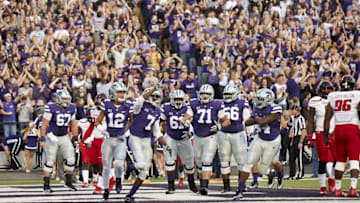 Oct 8, 2016; Manhattan, KS, USA; Kansas State Wildcats wide receiver Isaiah Zuber (7) celebrates with his teammates after scoring a touchdown in the first half at Bill Snyder Family Football Stadium. Mandatory Credit: Gary Rohman/MLS/USA TODAY Sports