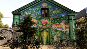 COPENHAGEN, DENMARK AUGUST 31: A building façade with street art seen at the freetown Christiania on August 31, 2019 in Copenhagen, Denmark. Christiania is a special quarter of Copenhagen based on alternative living and consensus democracy, established by squatters at a 34 hectare military area and barracks in 1971, today characterized by a more complex social structure from organized crime based on hash pushers to many small and lawful business. Christiania is one of the most important tourist attractions in Copenhagen. (Photo by Ole Jensen/Getty Images)