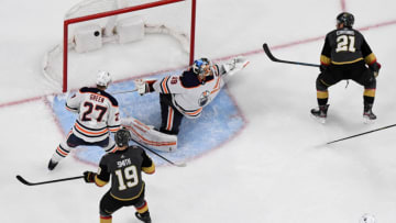 LAS VEGAS, NEVADA - FEBRUARY 26: Nick Cousins #21 of the Vegas Golden Knights scores a third-period power-play goal against Mikko Koskinen #19 of the Edmonton Oilers during their game at T-Mobile Arena on February 26, 2020 in Las Vegas, Nevada. The Golden Knights defeated the Oilers 3-0. (Photo by Ethan Miller/Getty Images)