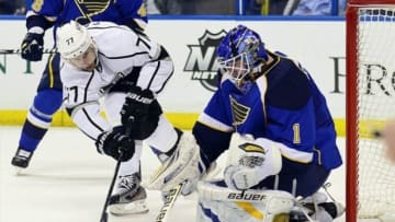 Apr 30, 2013; St. Louis, MO, USA; St. Louis Blues goalie Brian Elliott (1) makes a save on a shot by Los Angeles Kings center Jeff Carter (77) in game one of the first round of the 2013 Stanley Cup playoffs at the Scottrade Center. Mandatory Credit: Scott Rovak-USA TODAY Sports