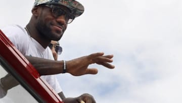 Jun 24, 2013; Miami, FL, USA; Miami Heat small forward LeBron James waves to the crowd during the Miami Heat Championship celebration parade in downtown Miami. Mandatory Credit: Robert Mayer-USA TODAY Sports