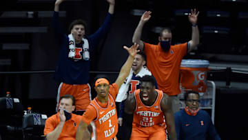 Jan 7, 2021; Evanston, Illinois, USA; Illinois Fighting Illini center Kofi Cockburn (21) reacts from the bench after Illinois Fighting Illini guard Trent Frazier (1) makes a three point basket in the second half against the Northwestern Wildcats at Welsh-Ryan Arena. Mandatory Credit: Quinn Harris-USA TODAY Sports