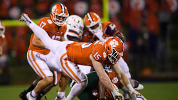 Oct 10, 2020; Clemson, South Carolina, USA; Clemson Tigers linebacker Jake Venables (15) tackles Miami Hurricanes wide receiver Mark Pope (6) during the third quarter at Memorial Stadium. Mandatory Credit: Ken Ruinard-USA TODAY Sports