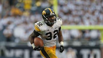 CHICAGO, IL - SEPTEMBER 01: Damon Bullock #32 of the Iowa Hawkeyes runs for the game-winning touchdown against the Northern Illinois Huskies at Soldier Field on September 1, 2012 in Chicago, Illinois. Iowa defeated Northern Illinois 18-17. (Photo by Jonathan Daniel/Getty Images)