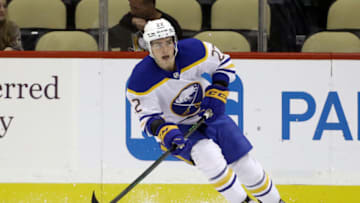 Oct 5, 2021; Pittsburgh, Pennsylvania, USA; Buffalo Sabres right wing Jack Quinn (22) skates with the puck against the Pittsburgh Penguins during the first period at PPG Paints Arena. Mandatory Credit: Charles LeClaire-USA TODAY Sports