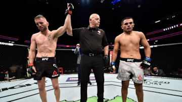 LAS VEGAS, NV - DECEMBER 30: (L-R) Tim Elliott is declared the victor over Mark De La Rosa by submission after their bantamweight bout during the UFC 219 event inside T-Mobile Arena on December 30, 2017 in Las Vegas, Nevada. (Photo by Jeff Bottari/Zuffa LLC/Zuffa LLC via Getty Images)