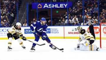 Nov 21, 2022; Tampa, Florida, USA;Tampa Bay Lightning left wing Nicholas Paul (20) skates with the puck as Boston Bruins left wing Brad Marchand (63) and Boston Bruins goaltender Linus Ullmark (35) defend during the first period at Amalie Arena. Mandatory Credit: Kim Klement-USA TODAY Sports