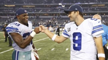 Sep 28, 2014; Arlington, TX, USA; Dallas Cowboys running back DeMarco Murray (29) celebrates with quarterback Tony Romo (9) after the game against the New Orleans Saints at AT&T Stadium. The Cowboys beat the Saints 38-17. Mandatory Credit: Matthew Emmons-USA TODAY Sports