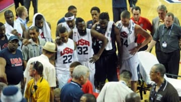 Aug 1, 2014; Las Vegas, NV, USA; The USA Basketball team players and coaching staff look on as guard Paul George is tended to by medical personnel after suffering a leg injury during the USA Basketball Showcase at Thomas & Mack Center. Mandatory Credit: Stephen R. Sylvanie-USA TODAY Sports
