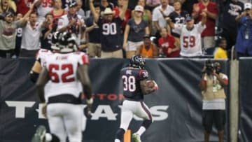 Aug 16, 2014; Houston, TX, USA; Houston Texans defensive back Andre Hal (38) returns an interception for a touchdown during the fourth quarter against the Atlanta Falcons at NRG Stadium. The Texans defeated the Falcons 32-7. Mandatory Credit: Troy Taormina-USA TODAY Sports