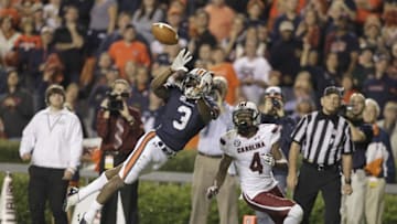 Oct 25, 2014; Auburn, AL, USA; Auburn Tigers defensive back Jonathan Jones (3) intercepts a pass intended for South Carolina Gamecocks receiver Shaq Roland (4) during the second half at Jordan Hare Stadium. The Tigers beat the Gamecocks 42-35. Mandatory Credit: John Reed-USA TODAY Sports